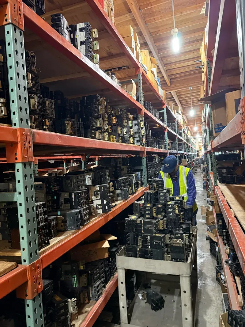Aisle of shelved circuit breakers in a warehouse — Oxnard, CA