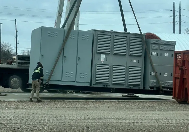 Crane setting a large diesel generator set in place — Seattle, WA
