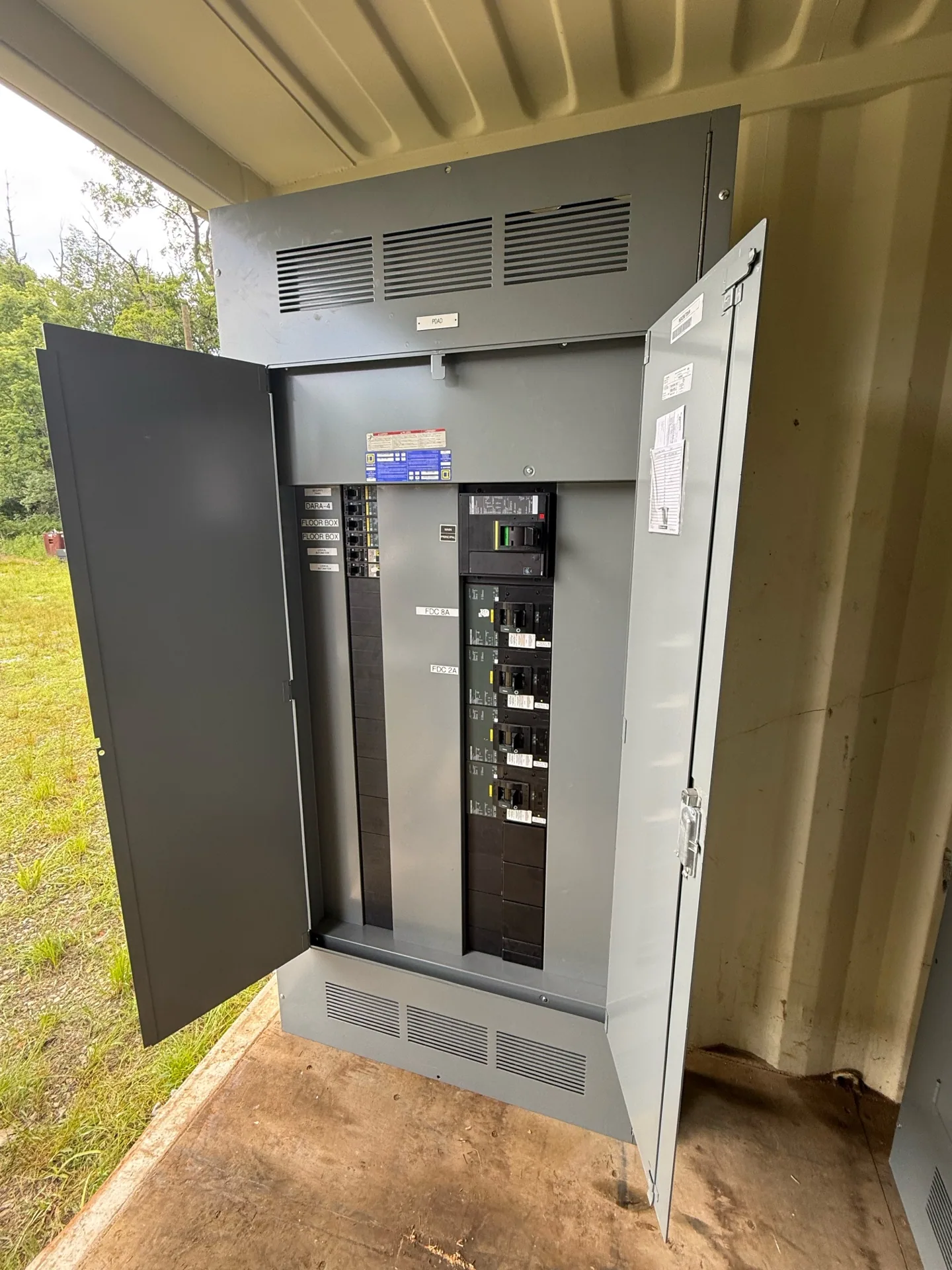 Panelboard with the door open showing branch breakers — Indio, CA