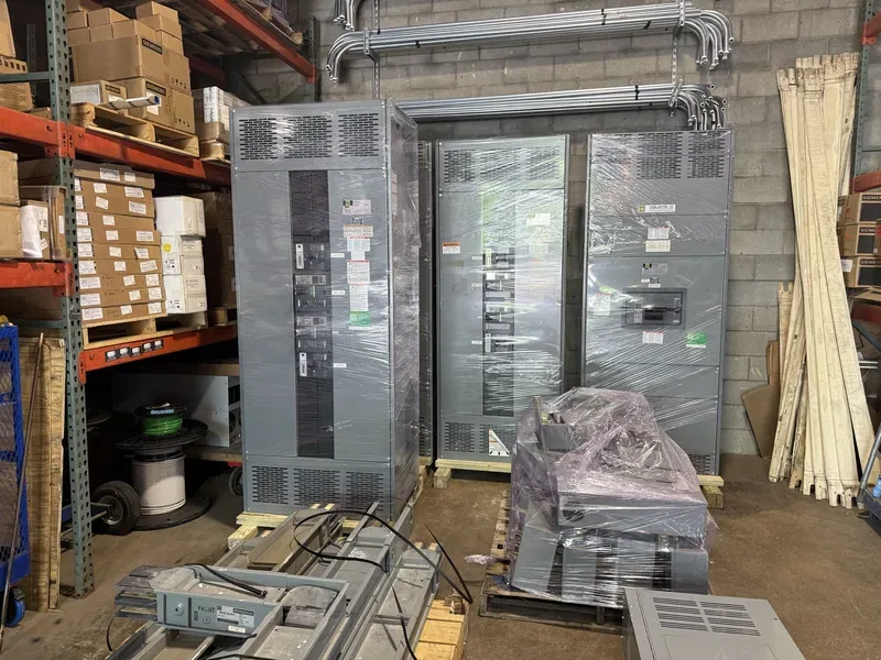 Panelboard and crated electrical parts in a warehouse — Provo, UT