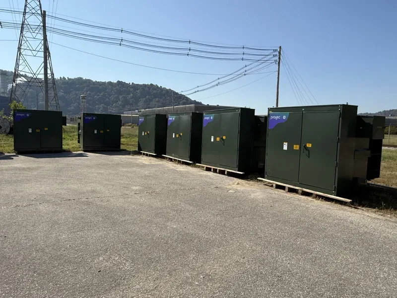 Line of pad-mount transformers under high-voltage transmission lines — Seattle, WA