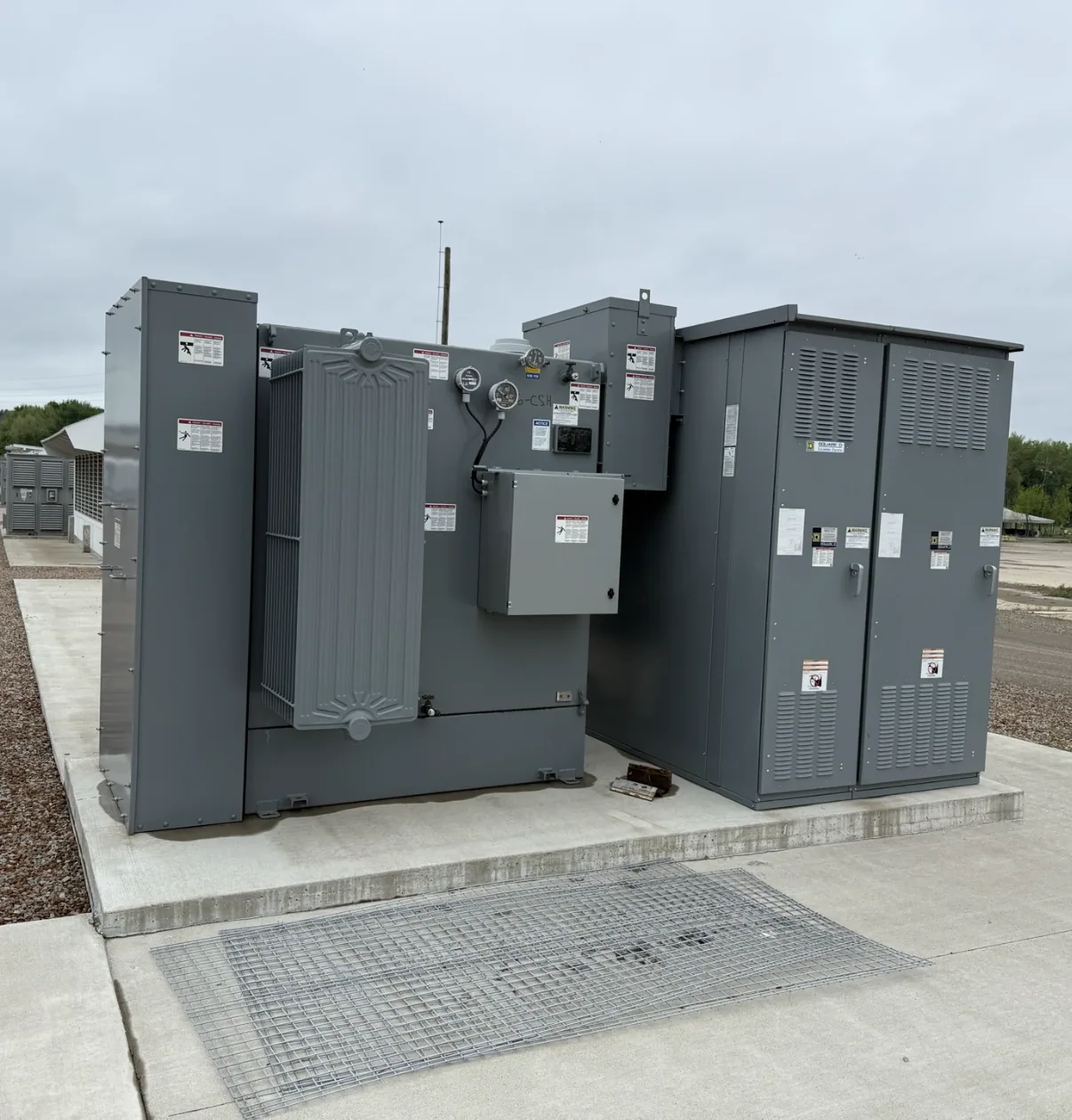 Pad-mount transformer and switching cabinet on a finished pad — Oakland, CA